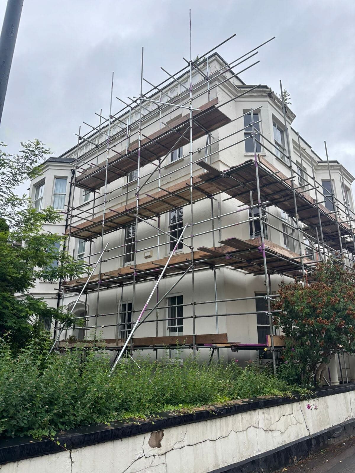 The building fully scaffolded for external alterations