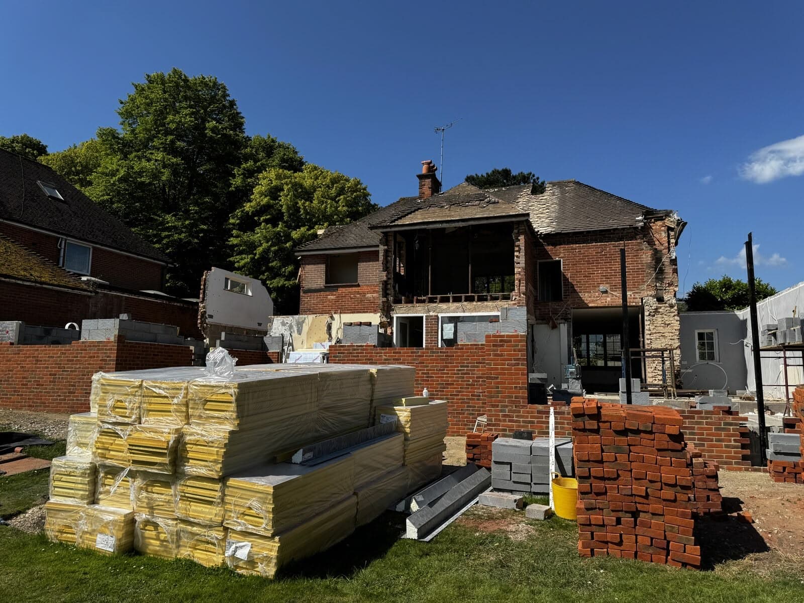 Materials on site with the rear of the house stripped back