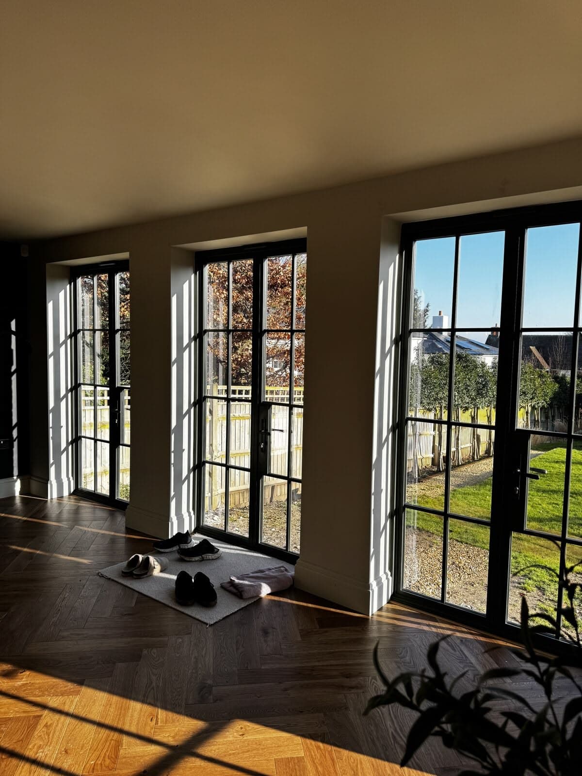 The glazed link connecting the house to the garden