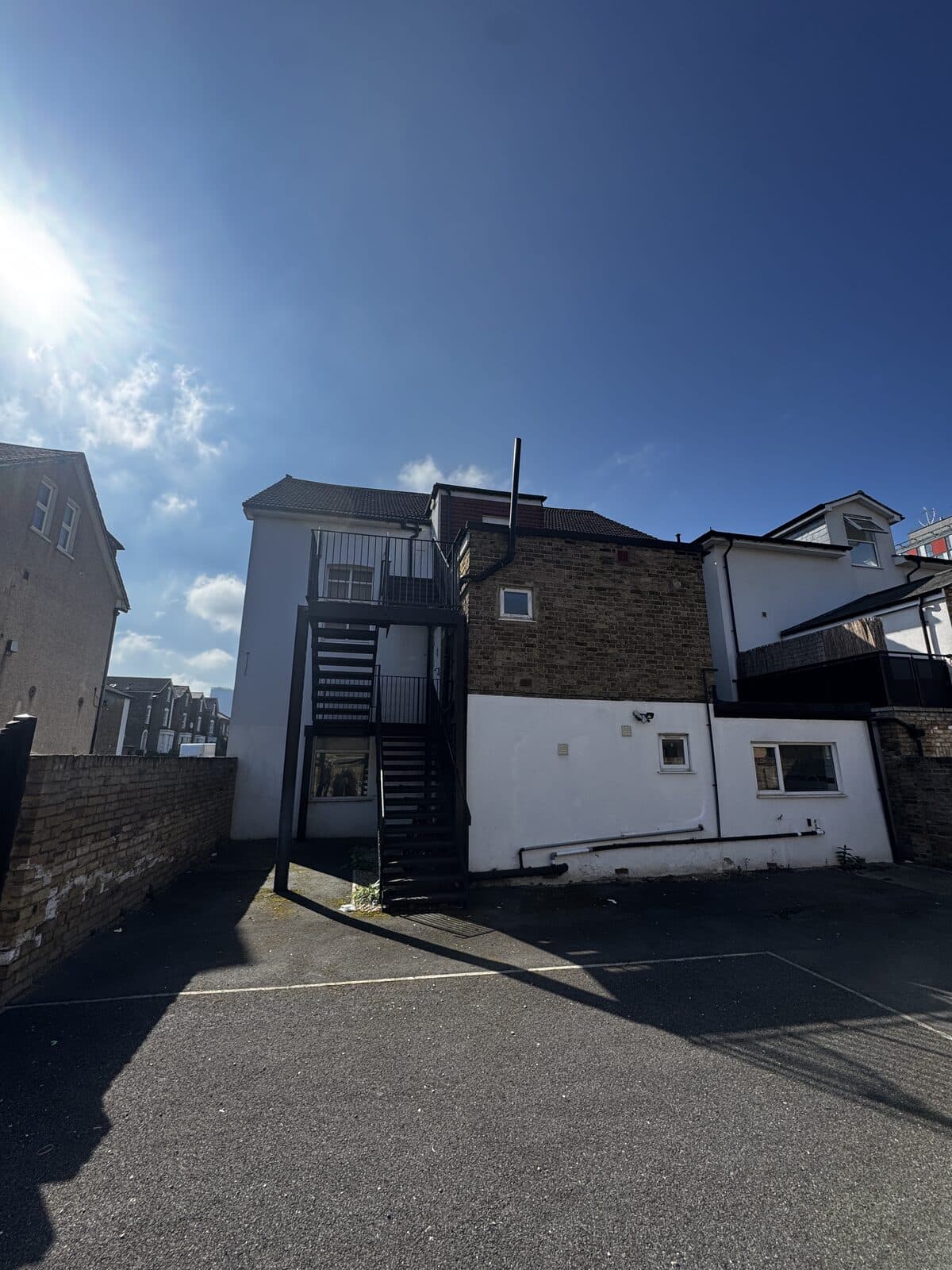 The side and rear of the existing building