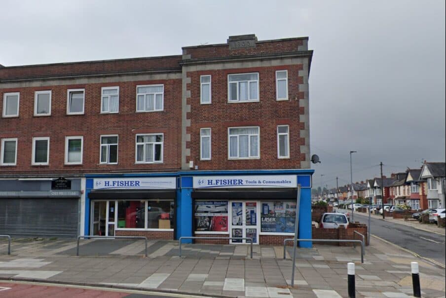 The parade of shops with the subject building at the end